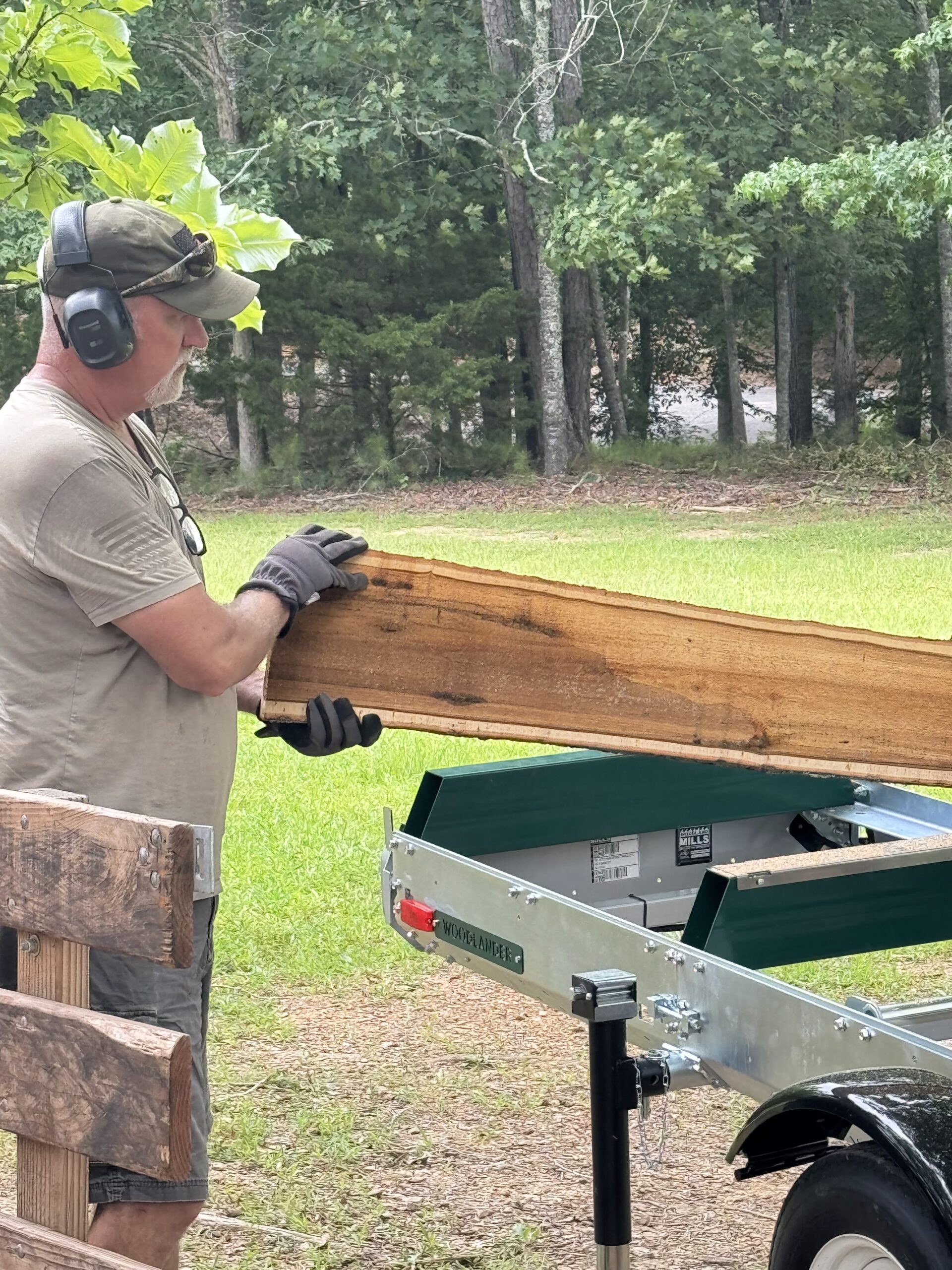 Lake Life Lawn and Property Maintenance Owner Scott Ball doing log clean up and removal crane hill alabama
